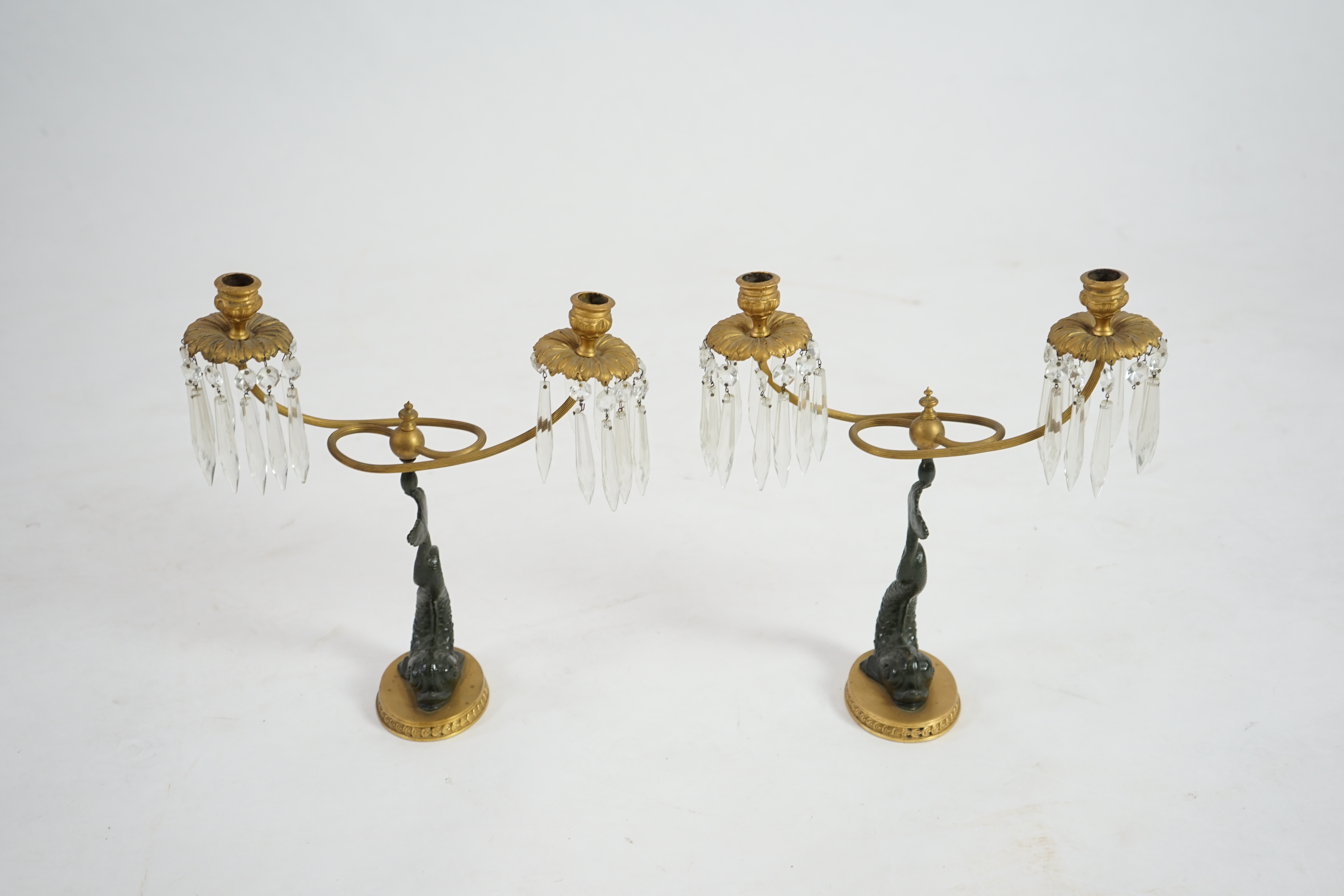 A pair of 19th century bronze and ormolu twin sconce candelabra